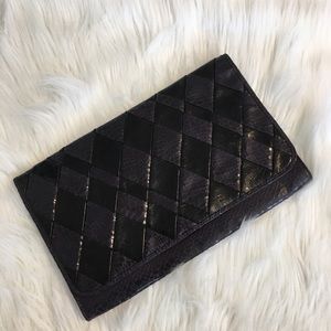 Purple and black clutch